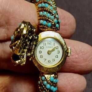 Norman Ladies peak-a-boo watch